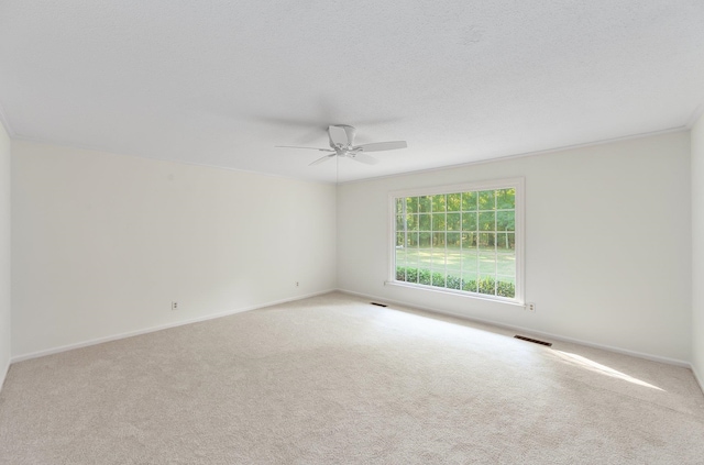 825 Barham Ln, Bolivar, TN 38008 - empty room with light carpet, a textured ceiling, and ceiling fan