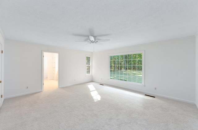 825 Barham Ln, Bolivar, TN 38008 - spare room with a textured ceiling, light colored carpet, and ceiling fan
