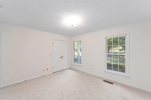 825 Barham Ln, Bolivar, TN 38008 - carpeted spare room with ornamental molding and a textured ceiling