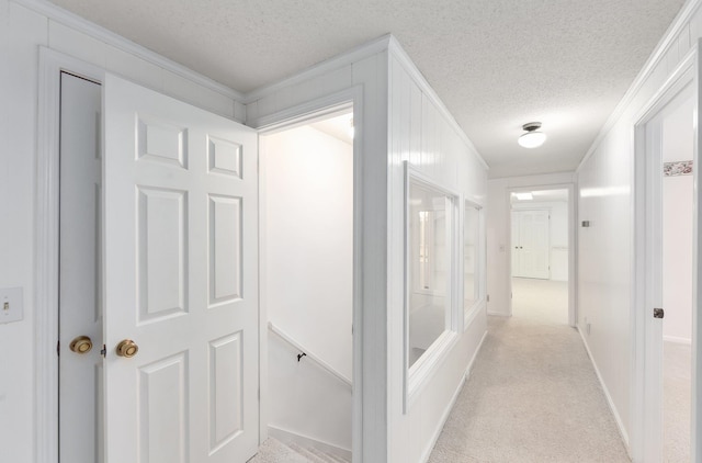 825 Barham Ln, Bolivar, TN 38008 - corridor with ornamental molding, a textured ceiling, and light colored carpet