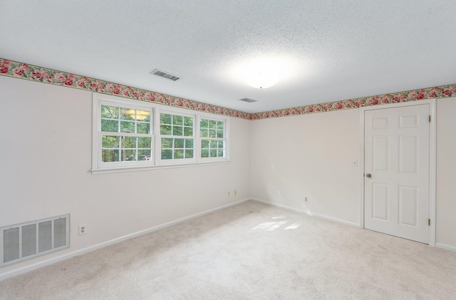 825 Barham Ln, Bolivar, TN 38008 - carpeted empty room with a textured ceiling