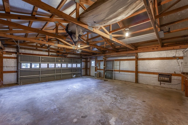 825 Barham Ln, Bolivar, TN 38008 - garage featuring a garage door opener and heating unit
