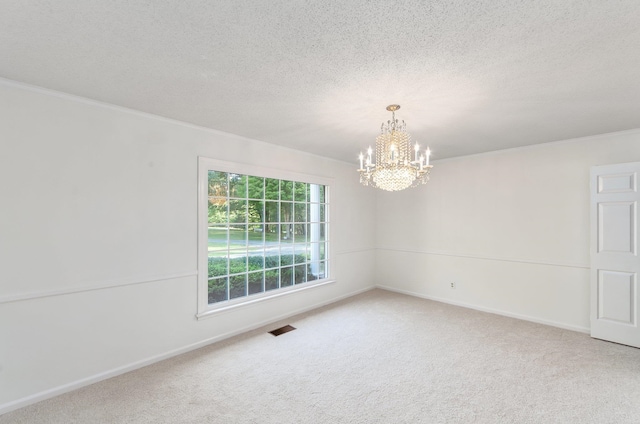 825 Barham Ln, Bolivar, TN 38008 - carpeted spare room featuring a notable chandelier and a textured ceiling