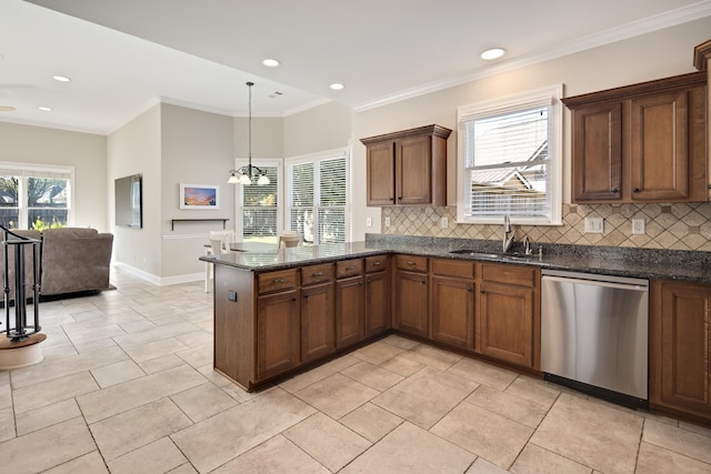 kitchen with decorative backsplash, dishwasher, a healthy amount of sunlight, and sink