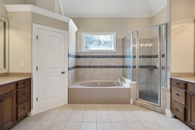 bathroom with tile patterned flooring, independent shower and bath, ornamental molding, vaulted ceiling, and vanity