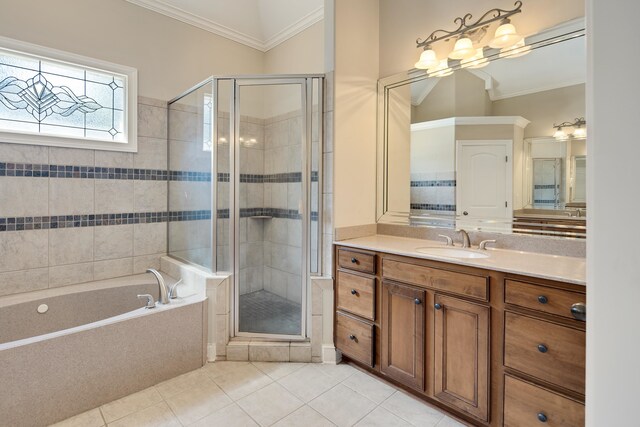 bathroom with vanity, crown molding, shower with separate bathtub, and tile patterned floors