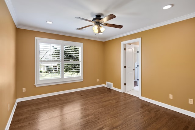 empty room with crown molding, dark hardwood / wood-style floors, and ceiling fan