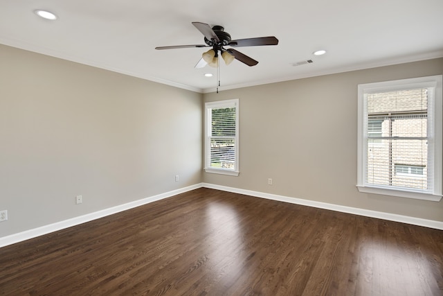 unfurnished room with ornamental molding, dark hardwood / wood-style floors, and a wealth of natural light