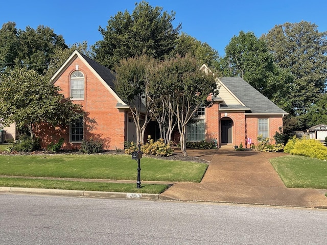 view of property featuring a front lawn