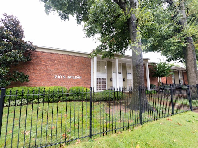 exterior space featuring a front lawn