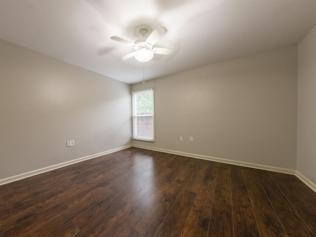 spare room featuring ceiling fan and dark hardwood / wood-style flooring