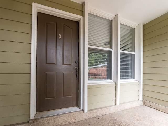 doorway to property featuring a porch