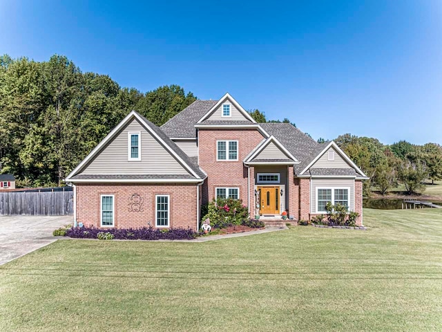 craftsman-style home featuring a front lawn