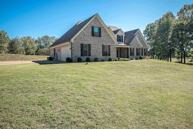 view of front of home featuring a front yard and a garage