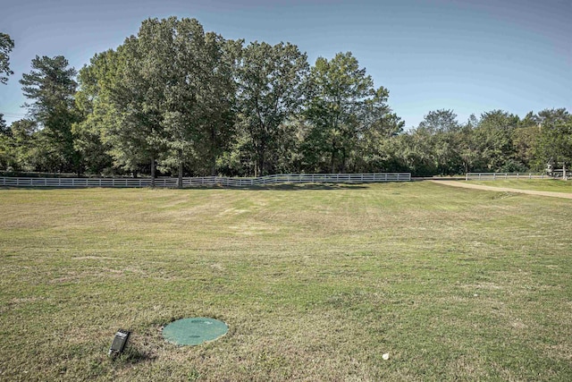 view of yard with a rural view