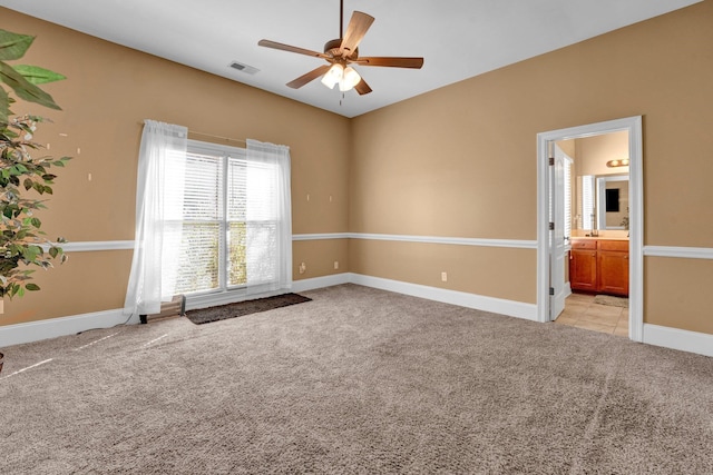 carpeted empty room featuring ceiling fan