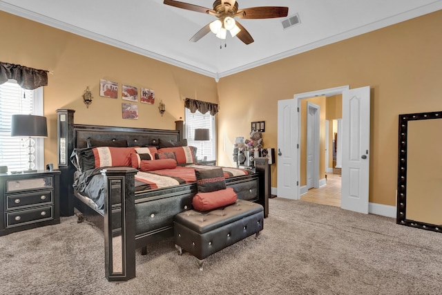 bedroom featuring ornamental molding, carpet floors, and ceiling fan