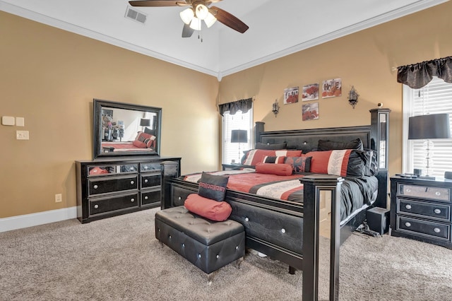 bedroom featuring ceiling fan, crown molding, multiple windows, and carpet floors