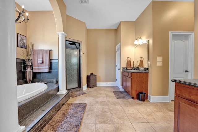 bathroom featuring vanity, plus walk in shower, ornate columns, and tile patterned flooring