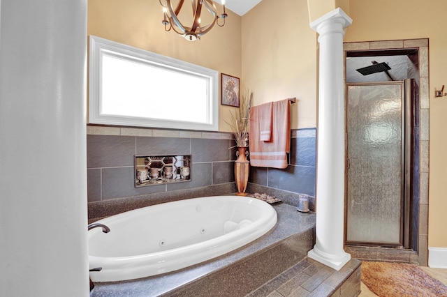 bathroom featuring independent shower and bath and decorative columns