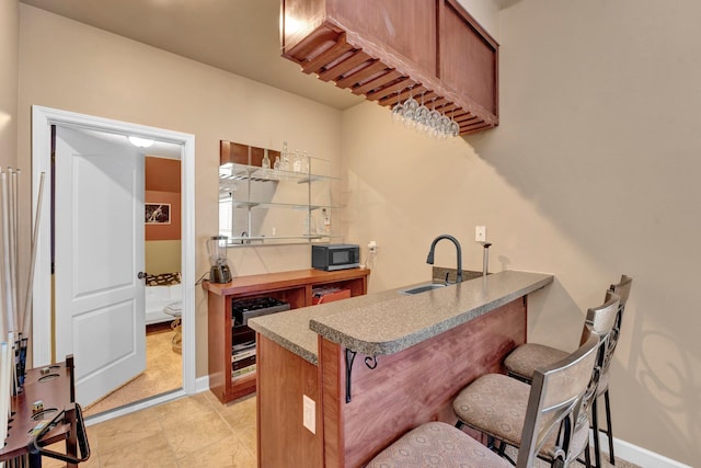 kitchen with sink and a breakfast bar