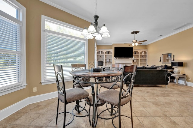 dining room featuring ornamental molding, built in shelves, and ceiling fan with notable chandelier