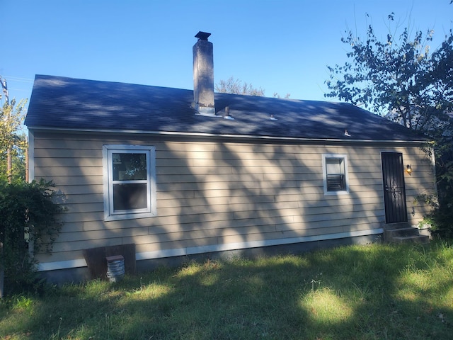 view of home's exterior featuring a yard