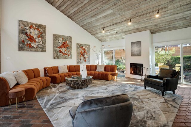 living room with wood ceiling, high vaulted ceiling, and track lighting