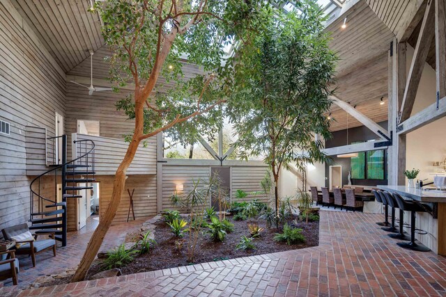 view of patio with area for grilling and an outdoor bar