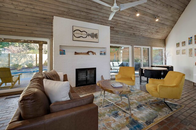 living room with wood ceiling, ceiling fan, high vaulted ceiling, and a wealth of natural light