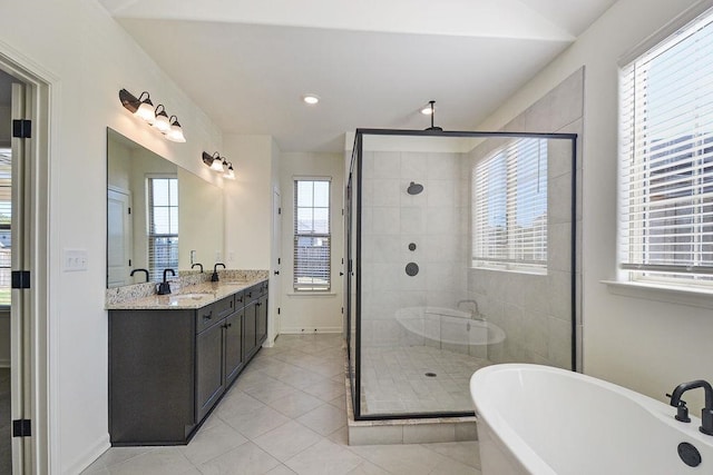 bathroom with vanity, independent shower and bath, and tile patterned flooring