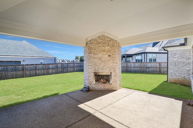 view of patio / terrace with an outdoor brick fireplace