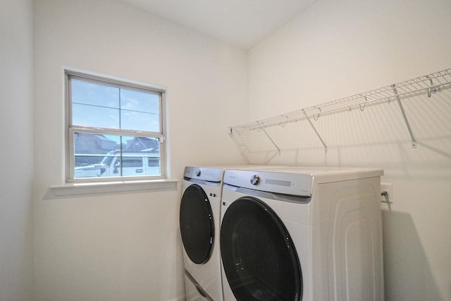 laundry area with independent washer and dryer