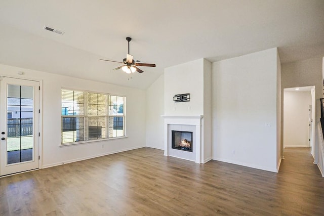 unfurnished living room featuring lofted ceiling, ceiling fan, and dark hardwood / wood-style flooring