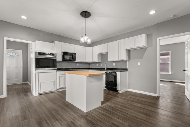 kitchen with black appliances, butcher block counters, dark hardwood / wood-style flooring, pendant lighting, and white cabinets