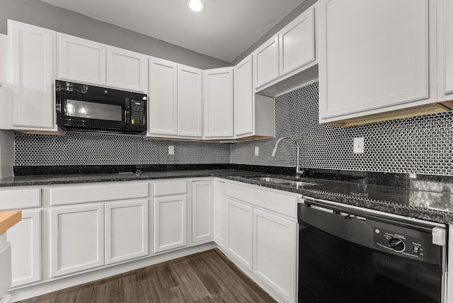 kitchen with sink, black appliances, and white cabinetry