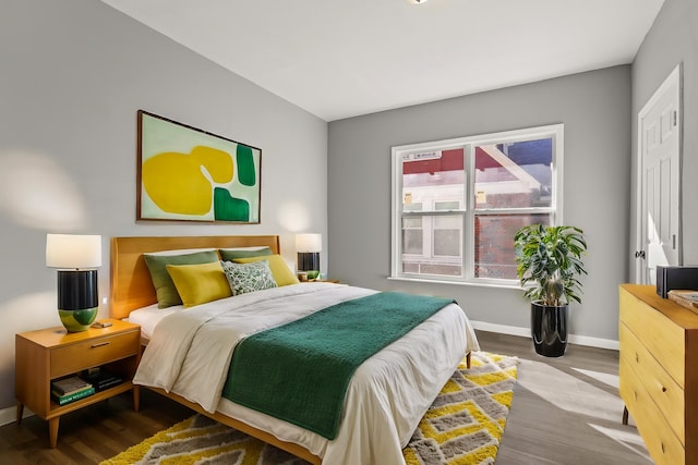 bedroom with wood-type flooring