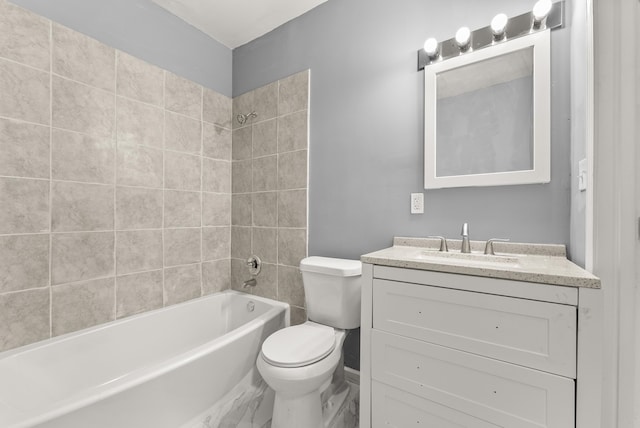 full bathroom with vanity, tiled shower / bath combo, and toilet