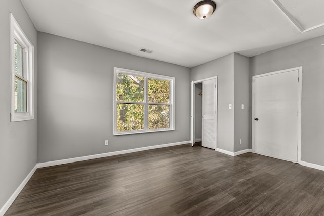 unfurnished bedroom featuring dark wood-type flooring