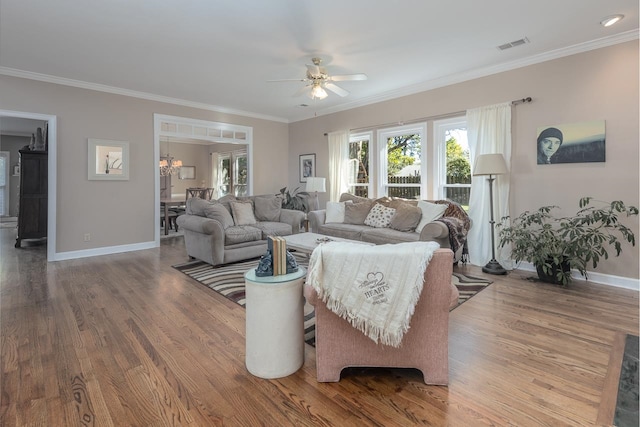 living room with ceiling fan, crown molding, and wood-type flooring