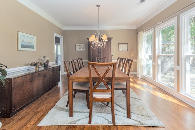 1842 Swynford Ln, Collierville, TN 38017 - dining room featuring wood finished floors, a chandelier, crown molding, and baseboards