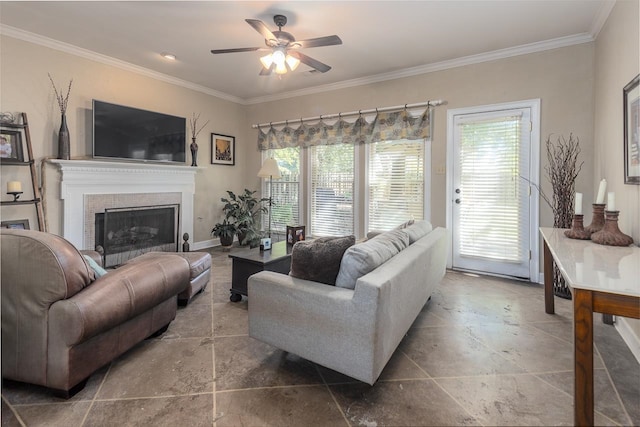 living room featuring crown molding, ceiling fan, and plenty of natural light