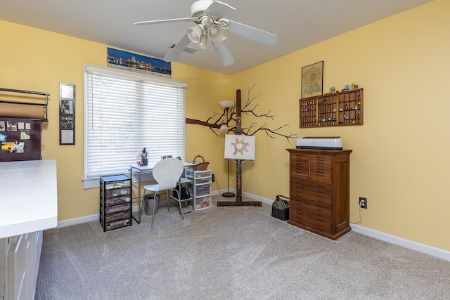 office with carpet floors and ceiling fan