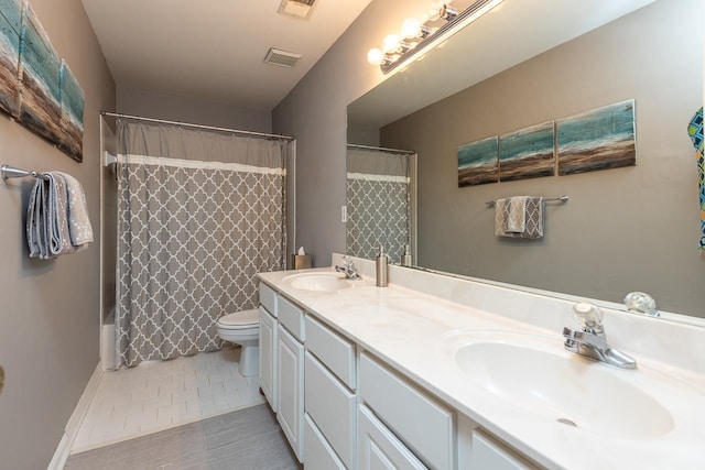 full bathroom with vanity, shower / bath combo, toilet, and tile patterned floors