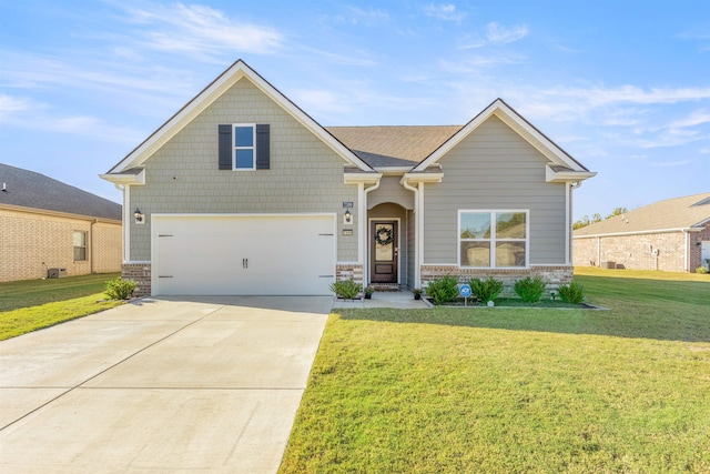 craftsman house featuring a front yard and a garage