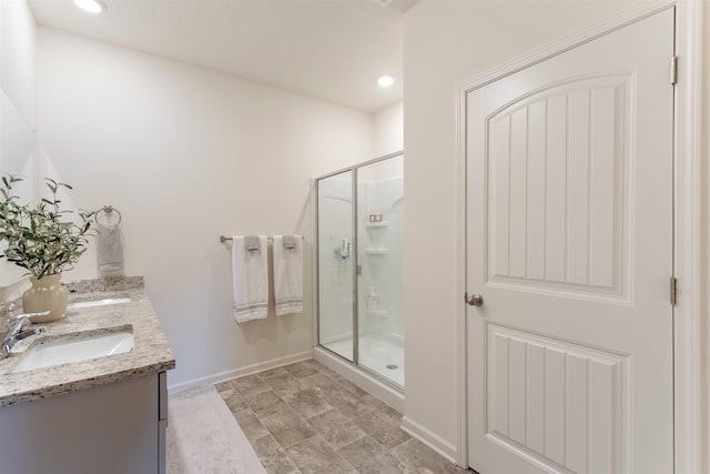 bathroom with vanity and an enclosed shower