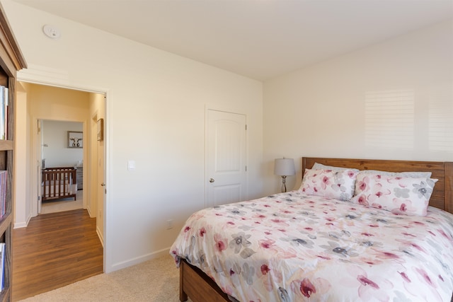 bedroom featuring dark carpet