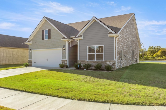 craftsman house featuring a front yard and a garage