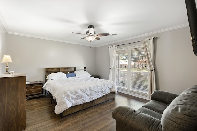 bedroom featuring ceiling fan, crown molding, and dark hardwood / wood-style flooring