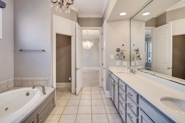 bathroom featuring vanity, a notable chandelier, ornamental molding, and tiled bath